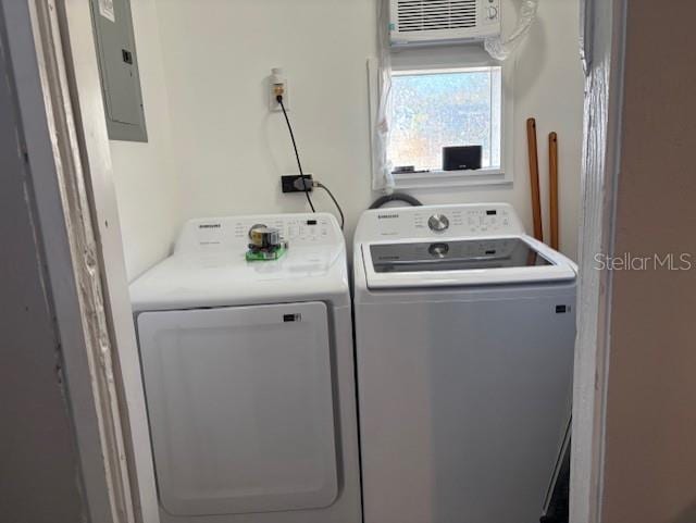 1408 San Juan Ct, Clearwater, FL 33756 - laundry room featuring electric panel, washer and dryer, and a wall mounted air conditioner