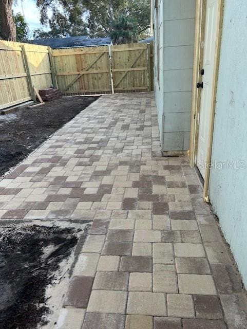 1408 San Juan Ct, Clearwater, FL 33756 - view of patio featuring a fenced backyard and a gate