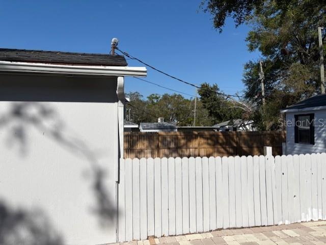 1408 San Juan Ct, Clearwater, FL 33756 - view of side of home with fence