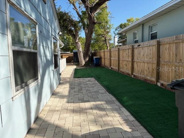1408 San Juan Ct, Clearwater, FL 33756 - fenced backyard with a patio