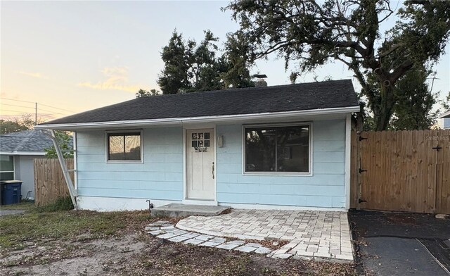 1408 San Juan Ct, Clearwater, FL 33756 - bungalow-style house featuring fence and roof with shingles
