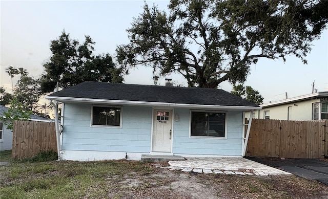 1408 San Juan Ct, Clearwater, FL 33756 - view of front of property with fence and a shingled roof