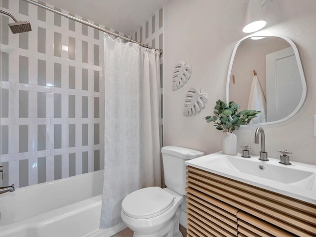 full bathroom featuring toilet, shower / bath combination with curtain, and vanity