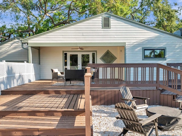 wooden deck featuring a ceiling fan