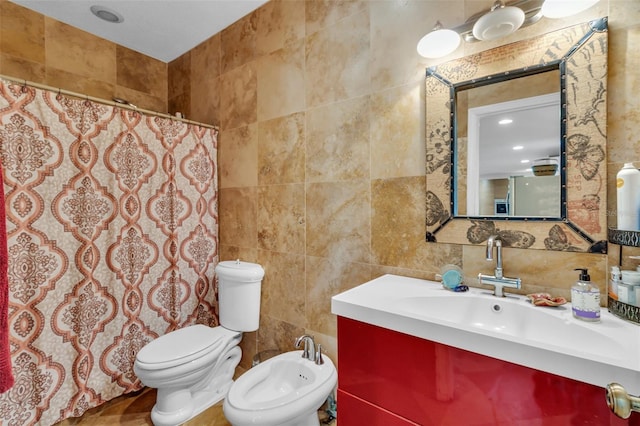 full bath with a bidet, curtained shower, toilet, vanity, and tile walls