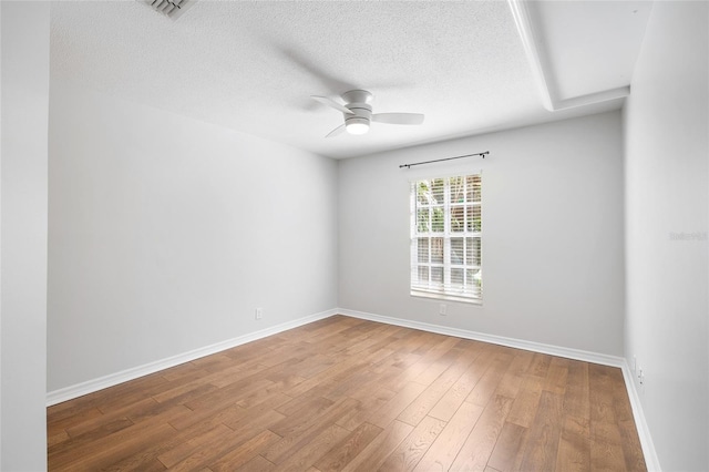 2314 S Clewis Ct Unit 106, Tampa, FL 33629 - unfurnished room featuring ceiling fan, baseboards, wood finished floors, and a textured ceiling
