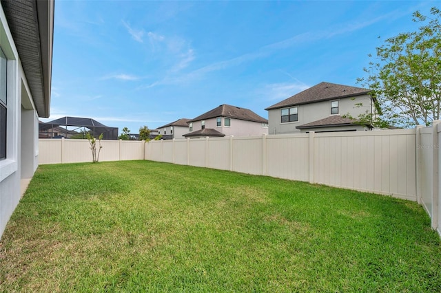 view of yard featuring a fenced backyard