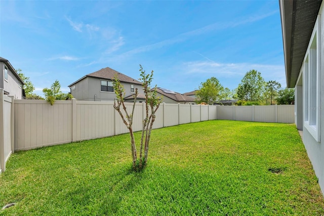 view of yard with a fenced backyard