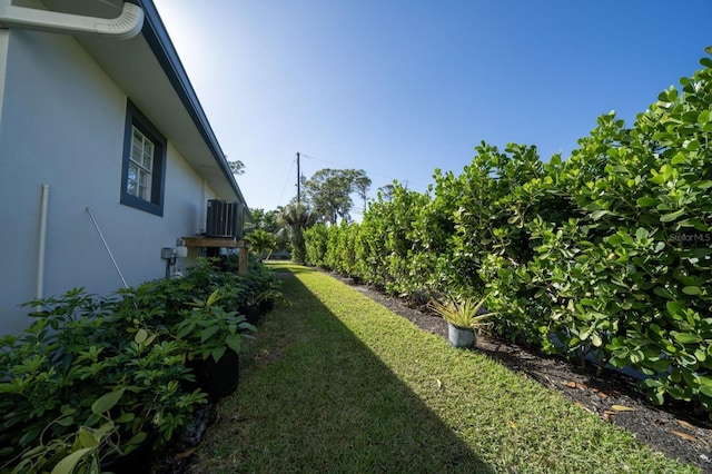 3986 Bennett Ln, Bonita Springs, FL 34134 - view of yard featuring central AC unit