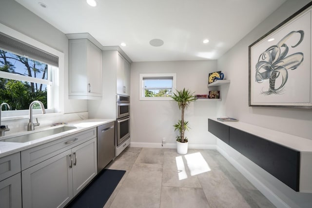 3986 Bennett Ln, Bonita Springs, FL 34134 - kitchen featuring light countertops, a sink, stainless steel appliances, and gray cabinets