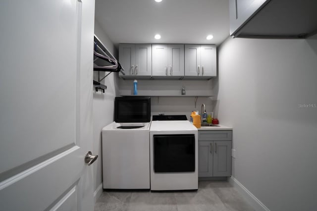 3986 Bennett Ln, Bonita Springs, FL 34134 - washroom featuring recessed lighting, baseboards, washing machine and clothes dryer, a sink, and cabinet space