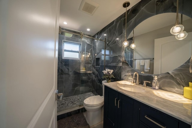3986 Bennett Ln, Bonita Springs, FL 34134 - full bathroom featuring toilet, vanity, a marble finish shower, visible vents, and decorative backsplash