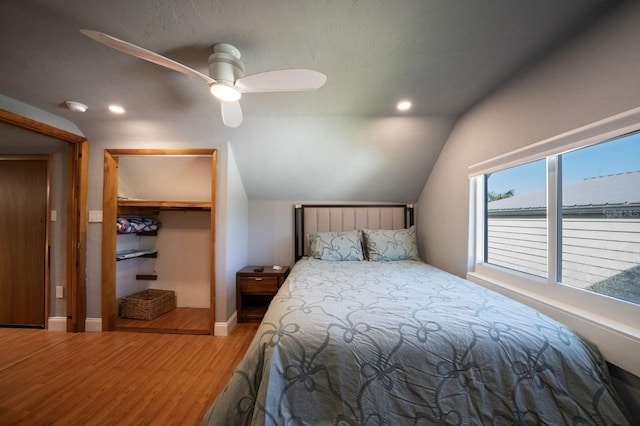 3986 Bennett Ln, Bonita Springs, FL 34134 - bedroom featuring a walk in closet, lofted ceiling, baseboards, ceiling fan, and wood finished floors