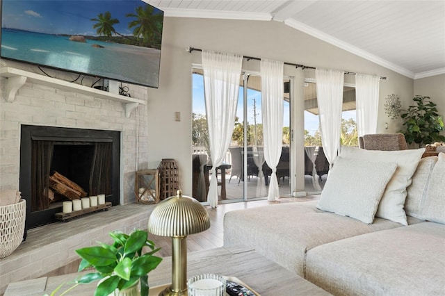 living room with lofted ceiling with beams, a fireplace, wood finished floors, and crown molding