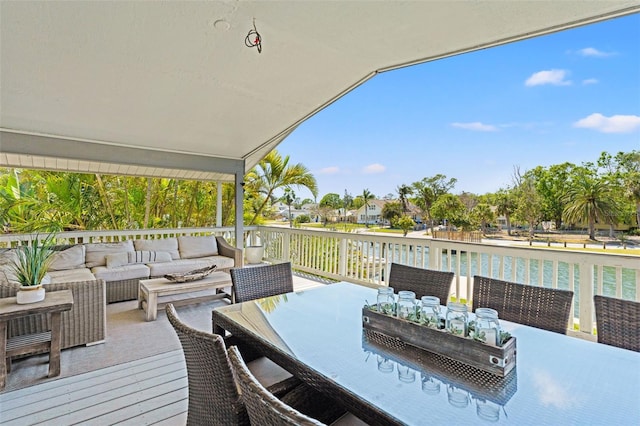 wooden deck featuring outdoor dining space and an outdoor living space