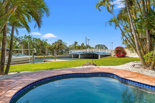 outdoor pool with a yard