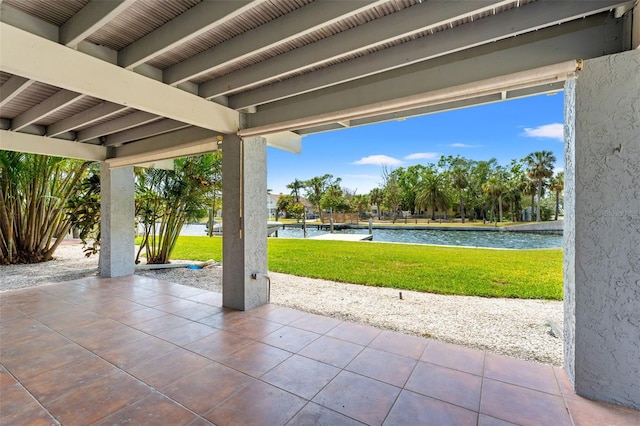 view of patio featuring a water view