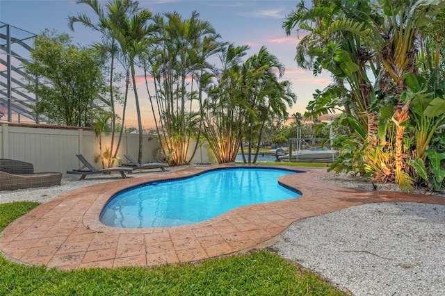 view of pool with fence, a fenced in pool, and a patio area