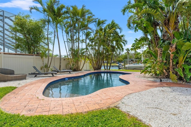view of pool with a patio area, fence, and a fenced in pool