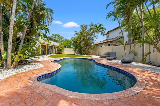 view of pool with a patio, a fenced in pool, and a fenced backyard