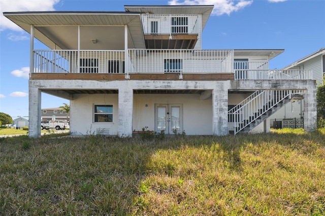 15621 Bertram Dr, Hudson, FL 34667 - back of house featuring french doors and stairway