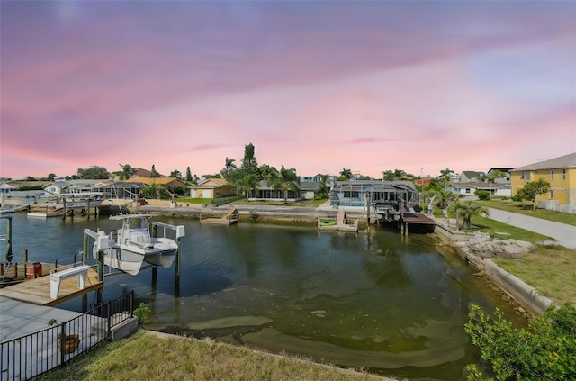 15621 Bertram Dr, Hudson, FL 34667 - dock featuring boat lift and a residential view