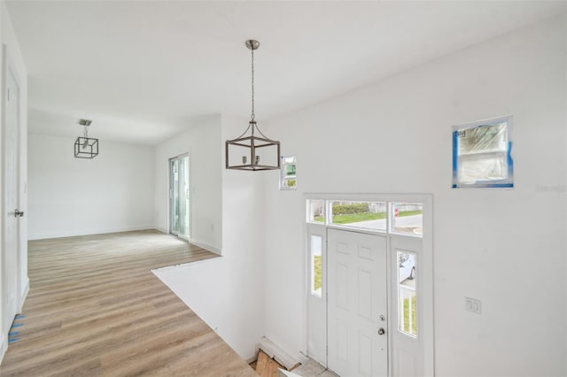 15621 Bertram Dr, Hudson, FL 34667 - entryway featuring light wood-type flooring and baseboards