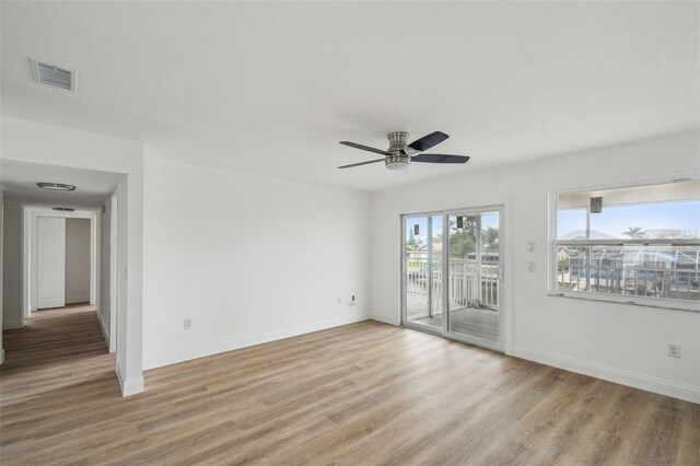 15621 Bertram Dr, Hudson, FL 34667 - unfurnished room with light wood-type flooring, ceiling fan, and baseboards