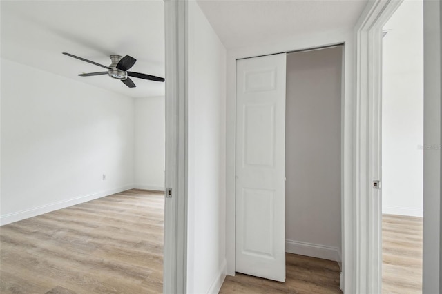 15621 Bertram Dr, Hudson, FL 34667 - unfurnished bedroom with wood finished floors, baseboards, and ceiling fan