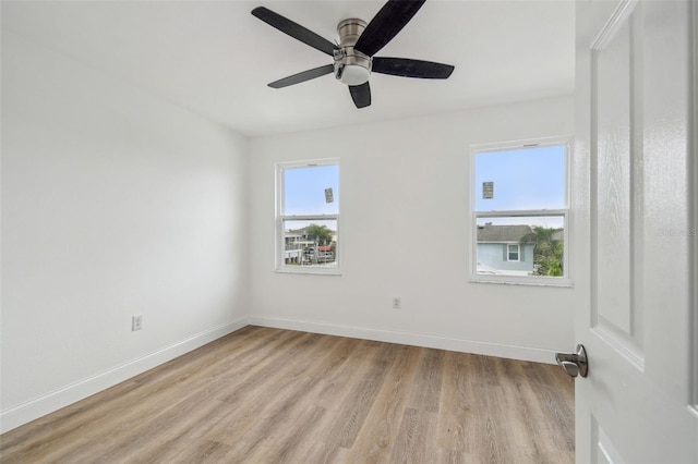 15621 Bertram Dr, Hudson, FL 34667 - spare room with light wood-type flooring, baseboards, and ceiling fan