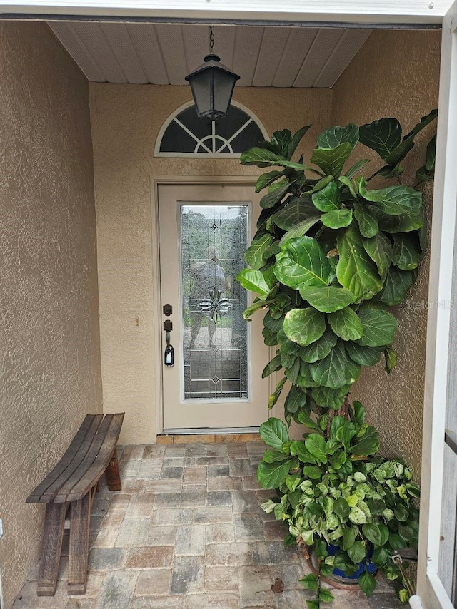 607 Manchester Woods Dr Unit 84, Sun City Center, FL 33573 - property entrance featuring stucco siding