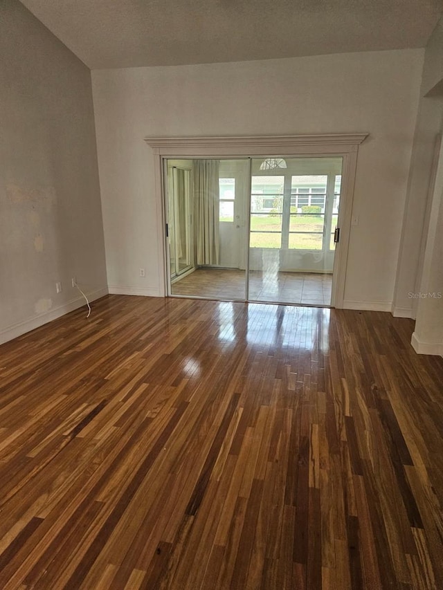 607 Manchester Woods Dr Unit 84, Sun City Center, FL 33573 - empty room featuring hardwood / wood-style floors and baseboards