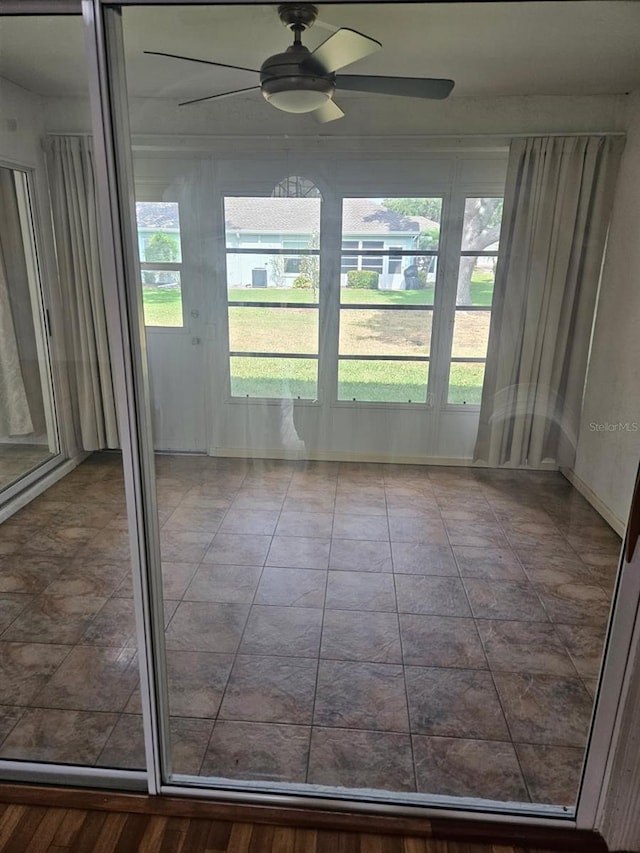 607 Manchester Woods Dr Unit 84, Sun City Center, FL 33573 - unfurnished sunroom featuring ceiling fan and healthy amount of natural light