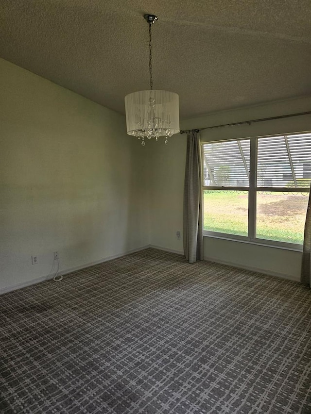 607 Manchester Woods Dr Unit 84, Sun City Center, FL 33573 - carpeted spare room with a chandelier, a textured ceiling, and baseboards