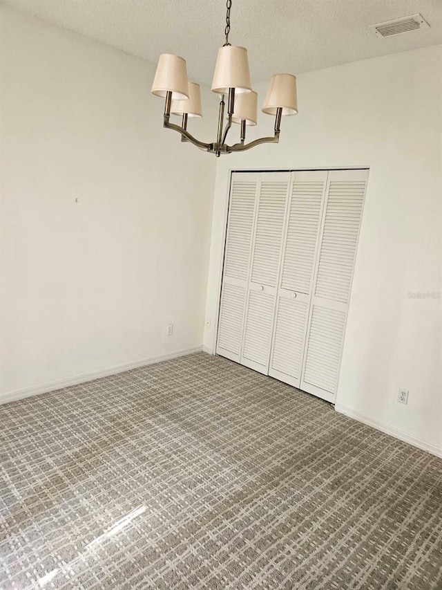 607 Manchester Woods Dr Unit 84, Sun City Center, FL 33573 - unfurnished bedroom with a chandelier, carpet floors, and baseboards