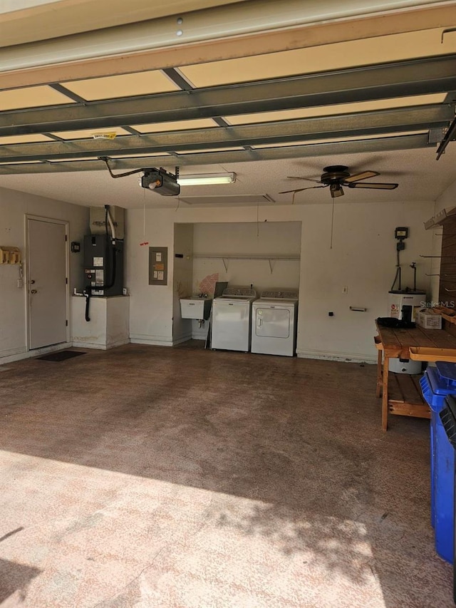 607 Manchester Woods Dr Unit 84, Sun City Center, FL 33573 - garage featuring washing machine and dryer, a garage door opener, electric panel, heating unit, and a sink