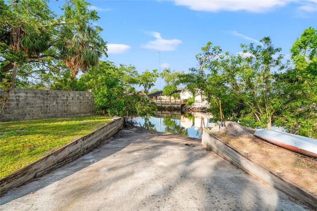 8615 Jackson Springs Rd, Tampa, FL 33615 - view of patio featuring a water view and fence