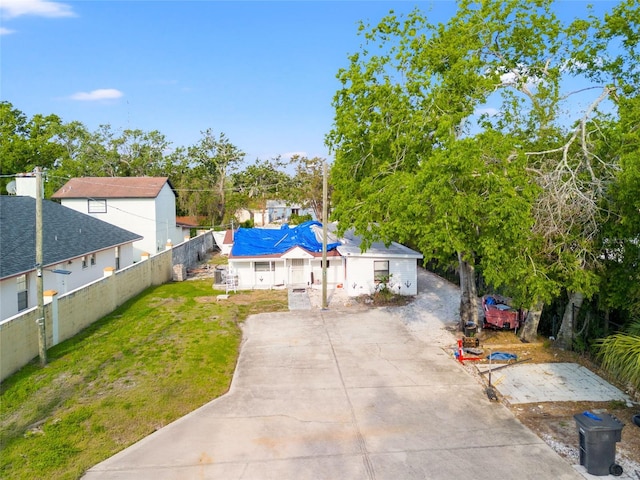 8615 Jackson Springs Rd, Tampa, FL 33615 - view of yard with concrete driveway and fence