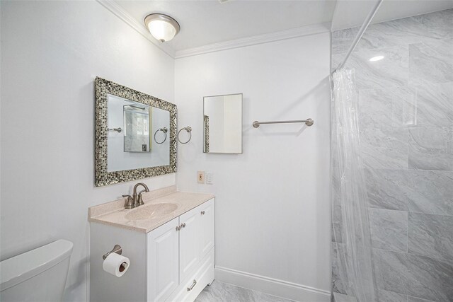 full bathroom with crown molding, baseboards, toilet, vanity, and tiled shower