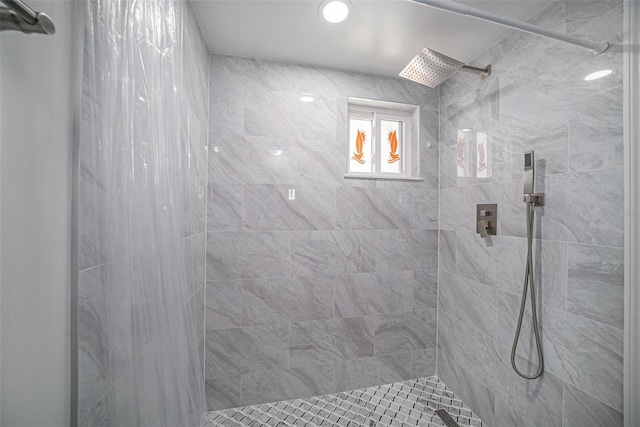 full bathroom featuring tiled shower