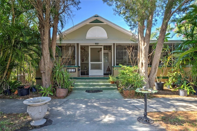 921 24th Ave N, Saint Petersburg, FL 33704 - view of front of home featuring a sunroom