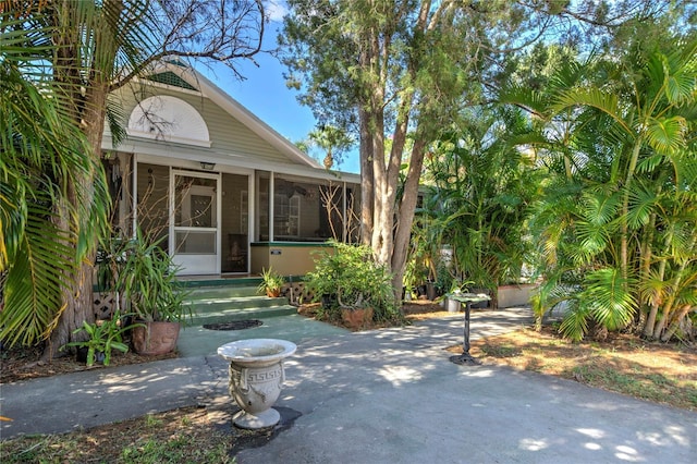 921 24th Ave N, Saint Petersburg, FL 33704 - view of front facade featuring a sunroom