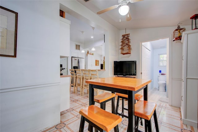 921 24th Ave N, Saint Petersburg, FL 33704 - dining area featuring a ceiling fan and light tile patterned flooring