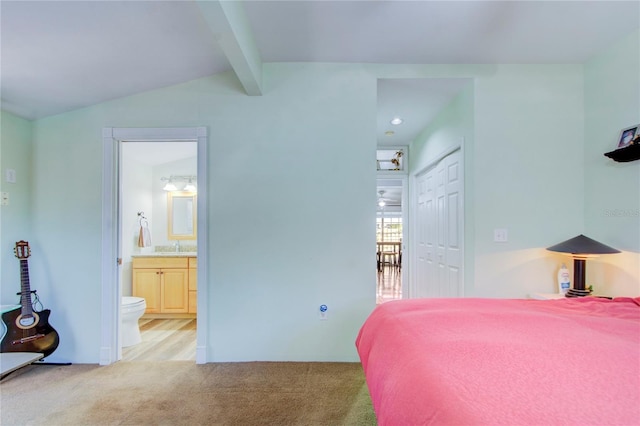 921 24th Ave N, Saint Petersburg, FL 33704 - bedroom featuring light carpet, a closet, and ensuite bath