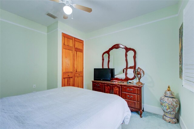 921 24th Ave N, Saint Petersburg, FL 33704 - bedroom with light colored carpet, baseboards, and a ceiling fan