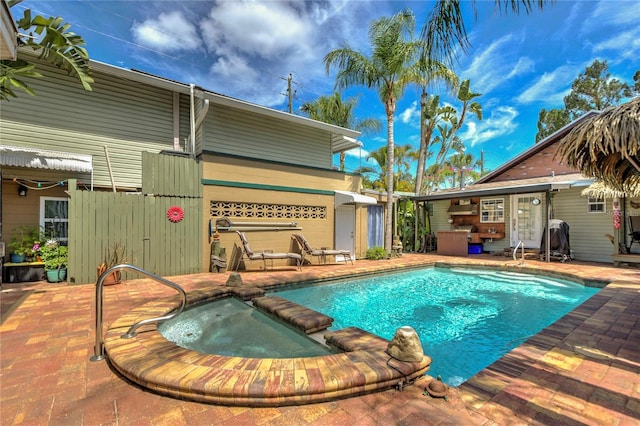 921 24th Ave N, Saint Petersburg, FL 33704 - view of swimming pool featuring a patio and a pool with connected hot tub