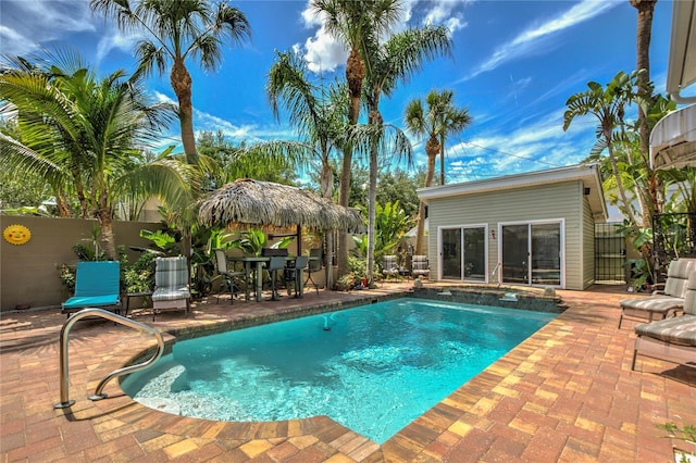 921 24th Ave N, Saint Petersburg, FL 33704 - view of pool featuring a patio area and a pool with connected hot tub