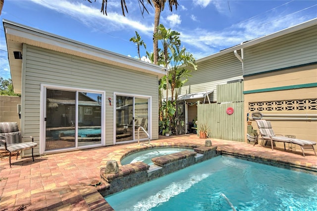 921 24th Ave N, Saint Petersburg, FL 33704 - view of pool with a patio and a pool with connected hot tub