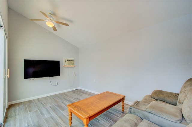 921 24th Ave N, Saint Petersburg, FL 33704 - living room with ceiling fan, lofted ceiling, light wood-style flooring, baseboards, and an AC wall unit