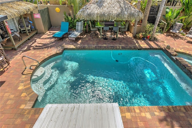 921 24th Ave N, Saint Petersburg, FL 33704 - view of swimming pool with a patio area, a gazebo, and outdoor dining space
